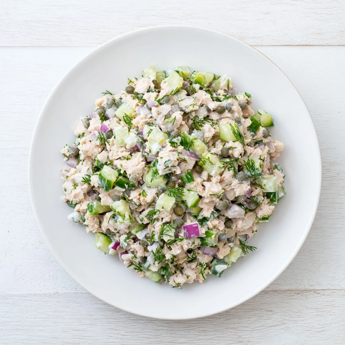 Freshly made chickpea tuna salad, with visible chunks, perfect for a healthy and tasty lunch.