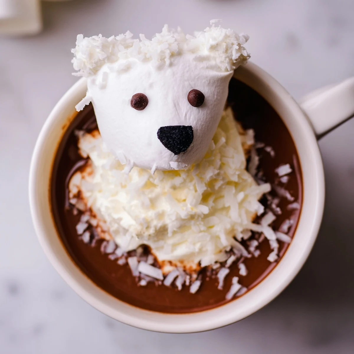 Steaming mugs of Polar Bear Hot Chocolate, a winter dessert platter of sweet treats.