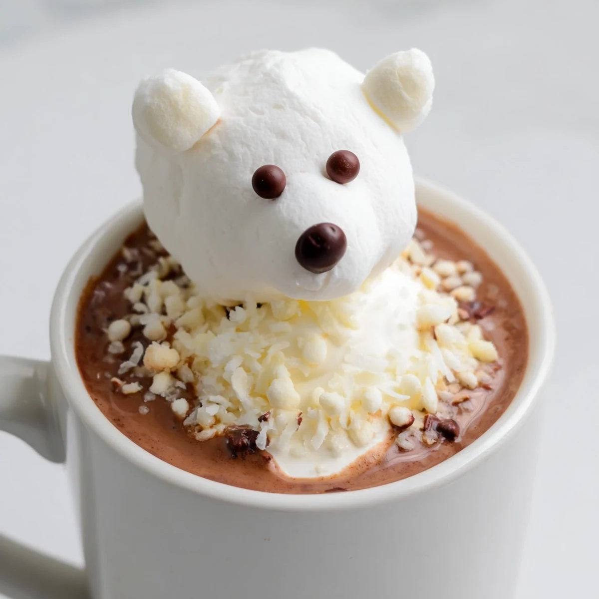 Indulge in this delightful Polar Bear Hot Chocolate, featuring fluffy marshmallows and chocolate chips.