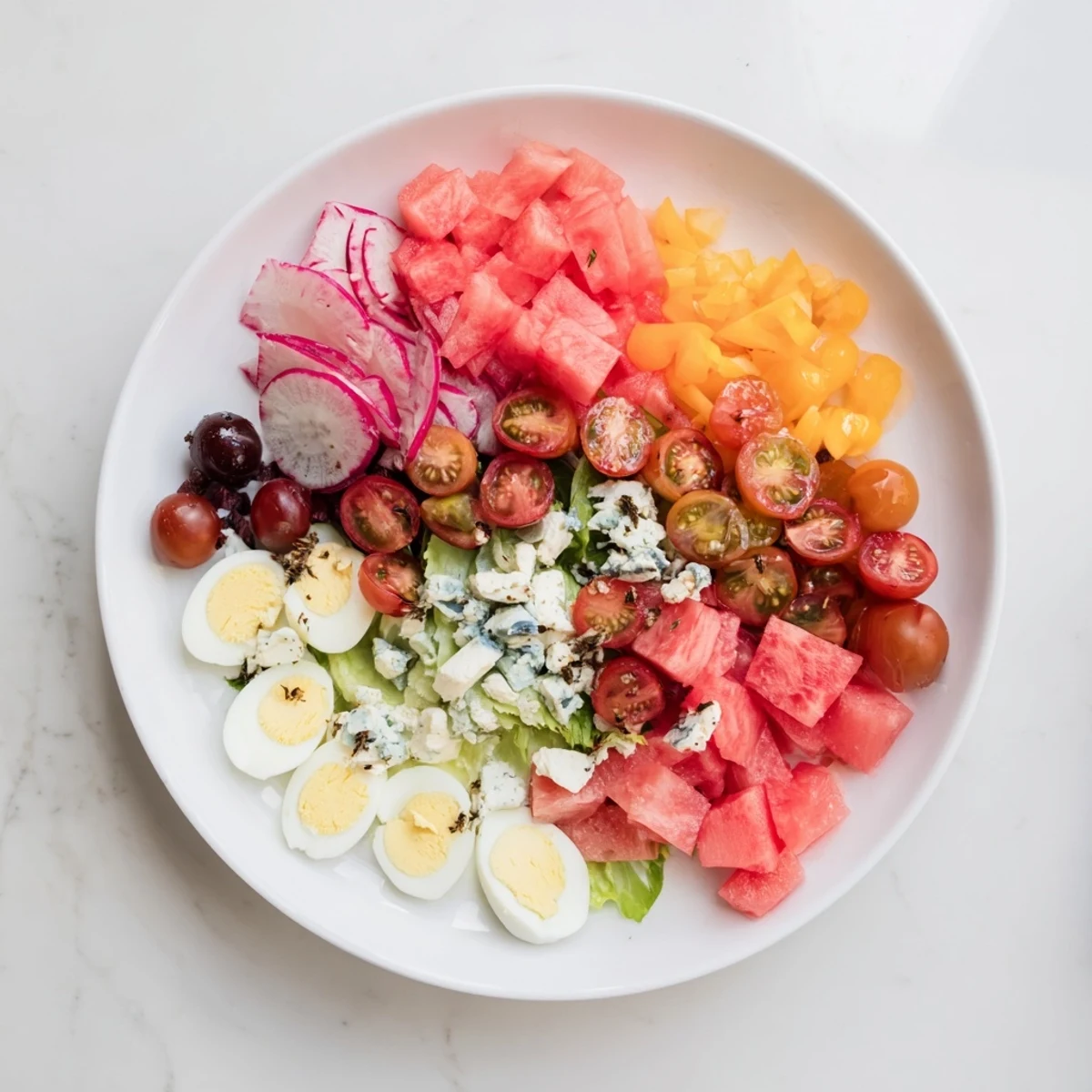 A gorgeous Baby Shower Pastel Palette Salad: pastel pink, blue, yellow components scattered on greens.