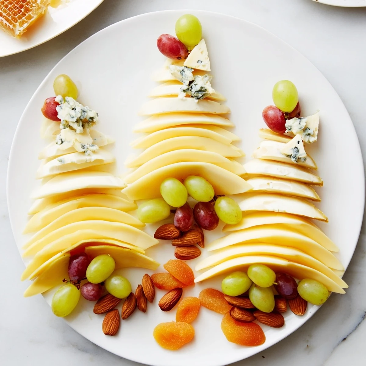 Art Deco Arch Cheese Platter with colorful grapes and sliced pears, visually stunning.