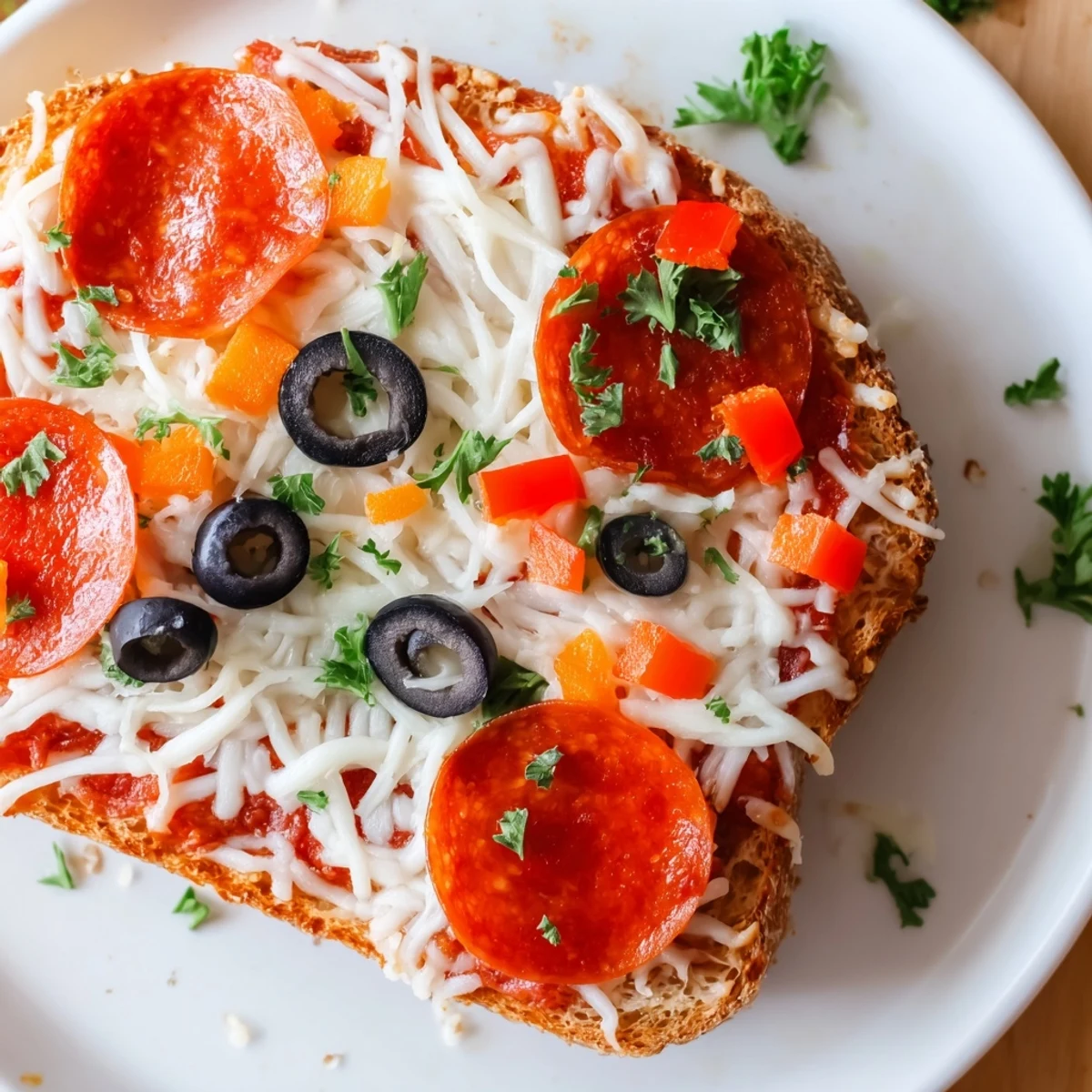 Crispy-edged Air Fryer Pizza Toast with bubbling cheese, savory pepperoni, and a garlic butter crust looks delicious.