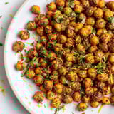 Vibrant plate of Harissa Chickpea Roast, a vegan snack, roasted until perfectly crunchy and delicious.