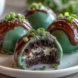 Vibrant green Oreo truffle balls with creamy filling and white chocolate coating, perfect for St. Patrick's Day celebrations.