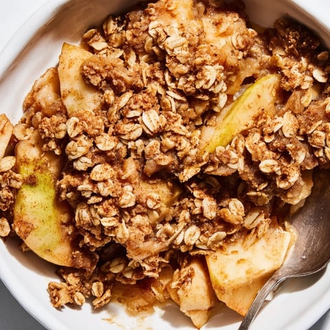 Warm Apple Crisp with oat topping, golden and bubbling, perfect with vanilla ice cream.  
