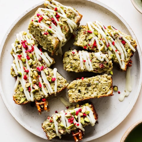 Matcha Pistachio Christmas Tree Blondie Bars: vibrant green treats, drizzled with white chocolate and festive sprinkles.