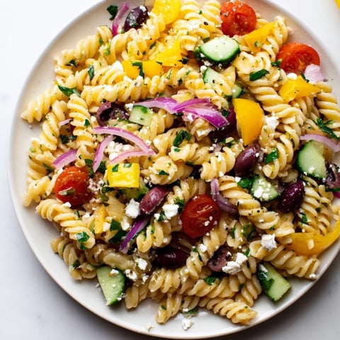 Vibrant Lemon Pasta Salad with fresh basil, feta cheese, and a bright, zesty lemon dressing.