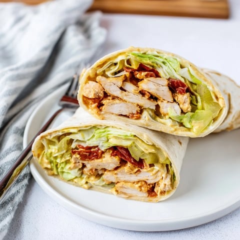 Golden-brown chicken tenders, fresh romaine lettuce, and tangy honey-mustard dressing wrapped in a warm, soft flour tortilla.  