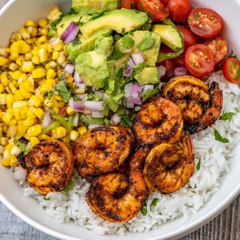 A delicious image shows the Easy Grilled Shrimp Bowl, brimming with fresh ingredients.