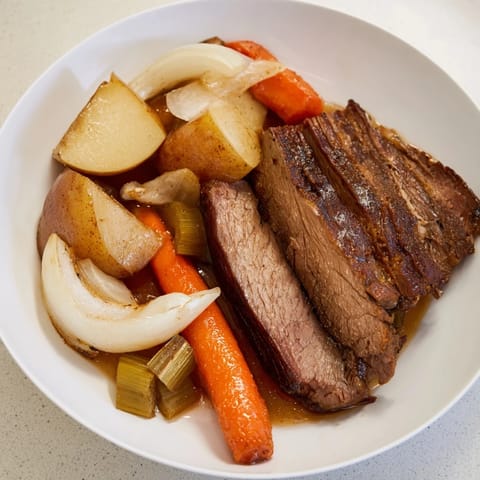 Hearty Sunday Pot Roast, showcasing a fork-tender beef roast with savory, rich gravy.
