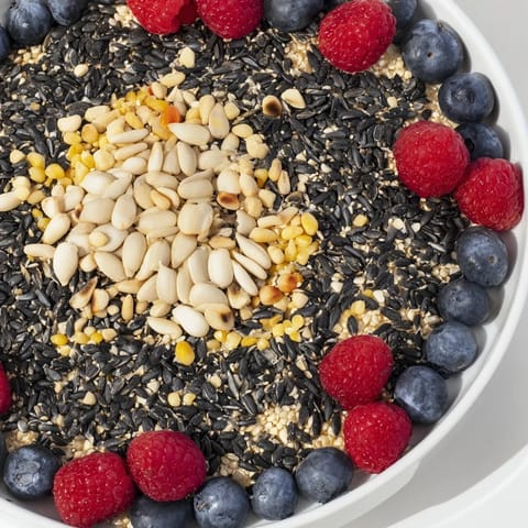 This bright Singing Bird Seed & Berry Platter features a mix of seeds and juicy, sweet berries.