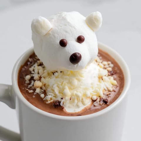 Indulge in this delightful Polar Bear Hot Chocolate, featuring fluffy marshmallows and chocolate chips.