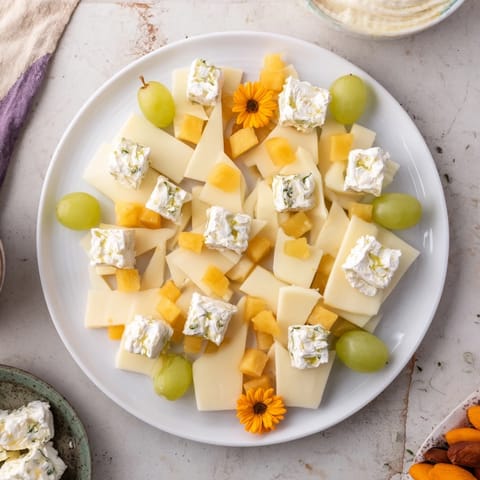This Bridal Shower Bubbly Board offers an elegant spread of cheeses and fruits with refreshing sparkling wine.