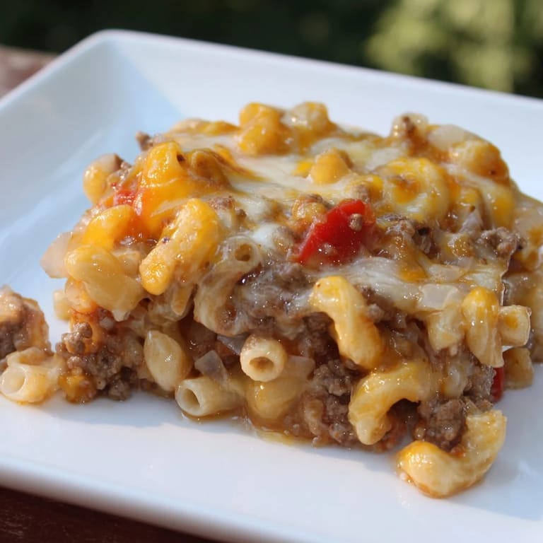 Hearty Hamburger Casserole baked to perfection; a warm, savory dinner with pasta and beef.