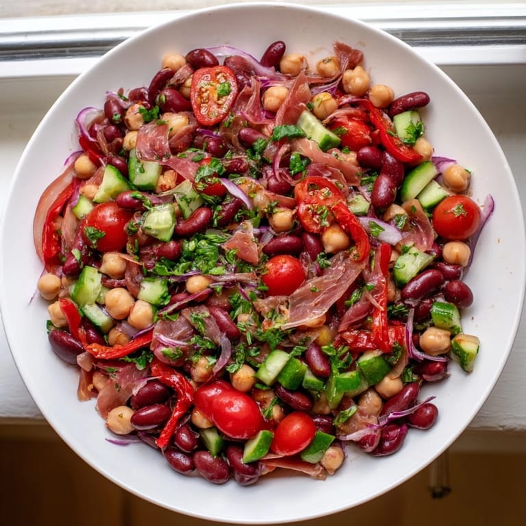 Hearty and flavorful, this Dense Bean Salad with Prosciutto boasts fresh herbs and zesty vinaigrette dressing.