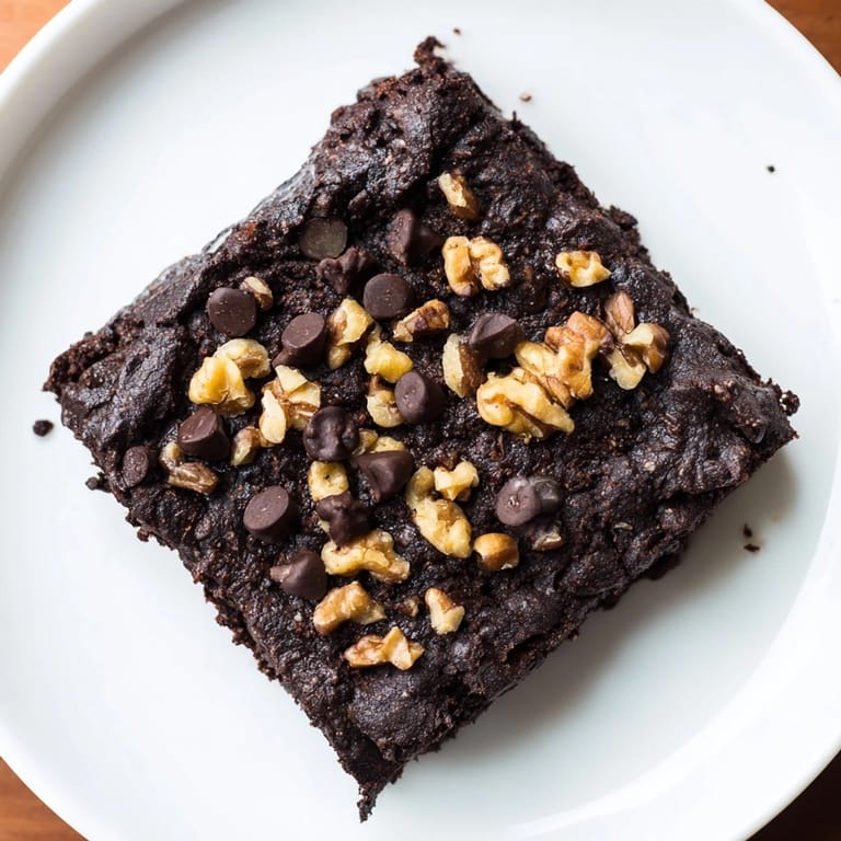 These decadent black bean brownies, baked to perfection, await a delightful, chocolate-filled bite.
