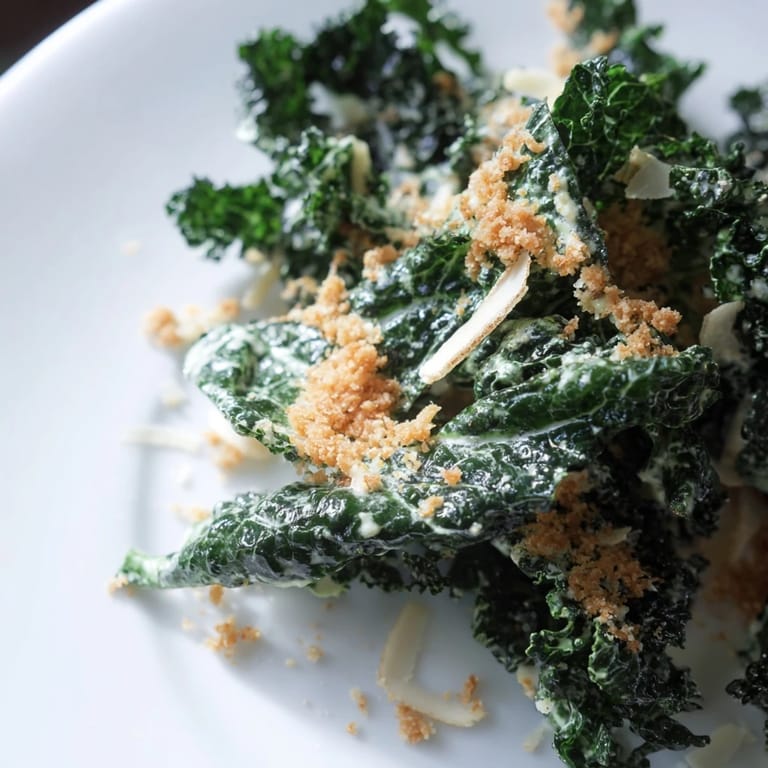 This vegetarian garlic Parmesan kale salad is served with crisp breadcrumbs, ready to enjoy as a flavorful 15-minute dinner side dish.