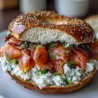 Fluffy cottage cheese bagels topped with silky smoked salmon, cream cheese, and fresh cucumber slices.  